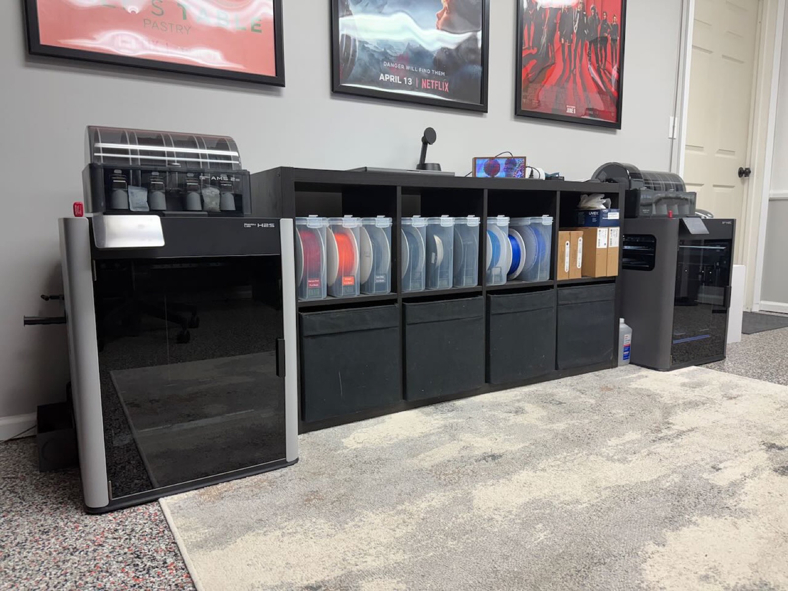 The Dapper Design lab: printers, filament storage, and a working bench